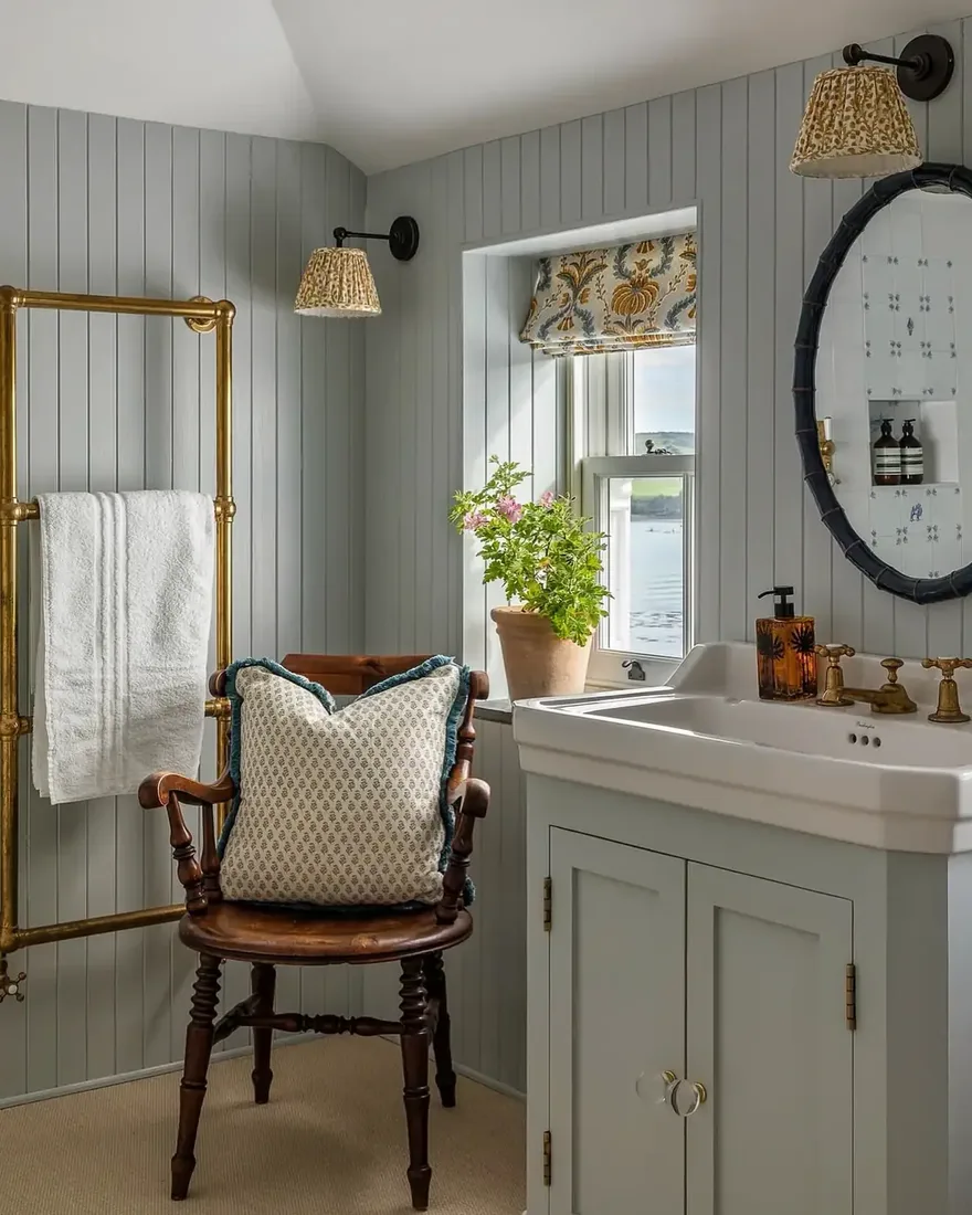 Bathroom with tile to the ceiling, vanity and soft lighting