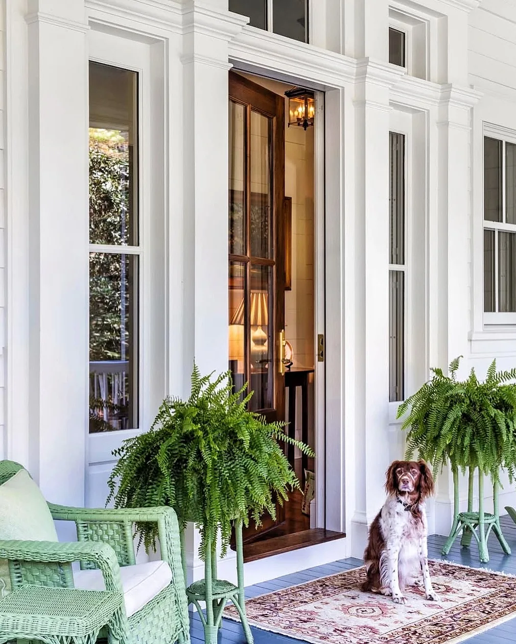Welcoming farmhouse front porch with seating and layered entry styling