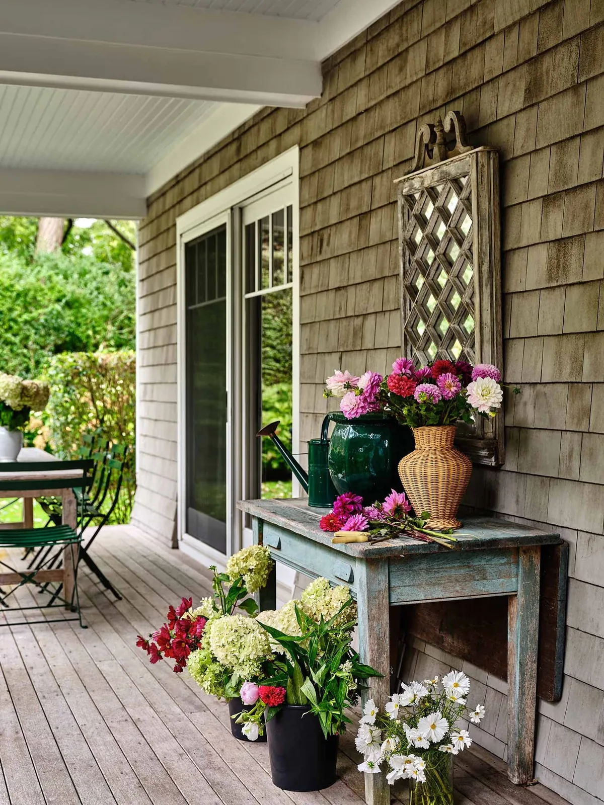 Rustic porch console table dressed with cut flowers
