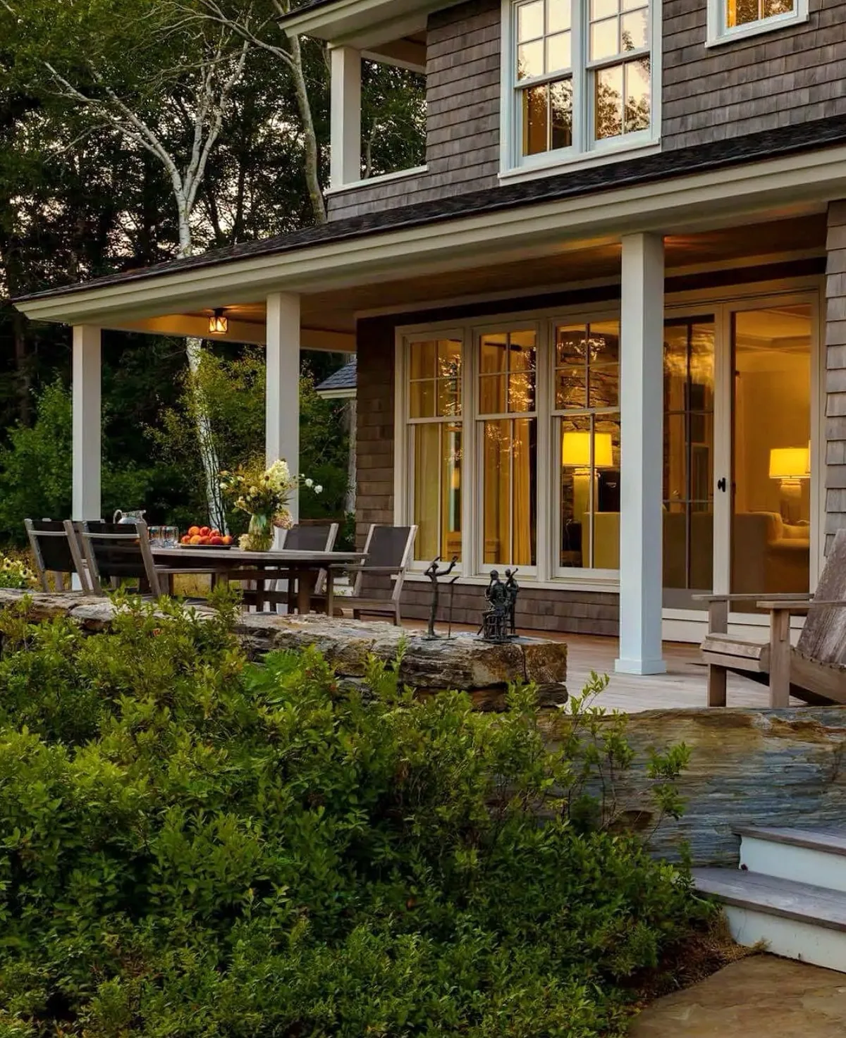 Covered porch set for outdoor dining under a sheltering roof