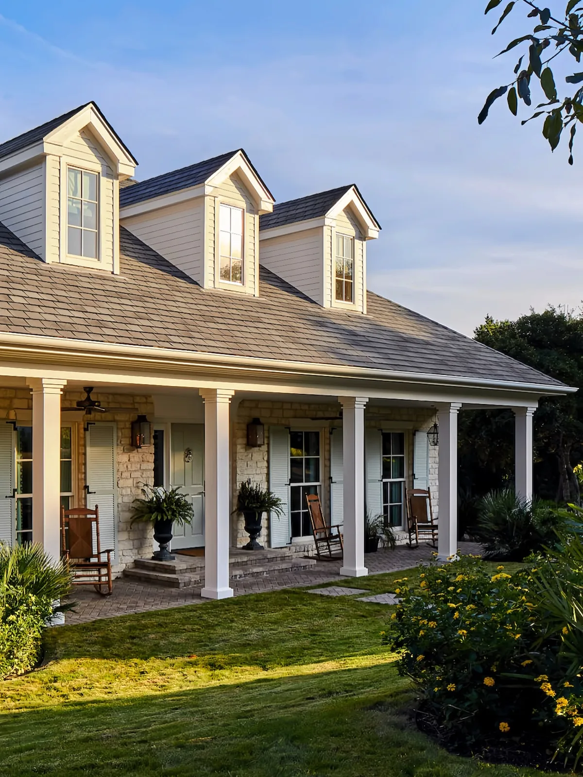 White farmhouse covered front porch in soft daylight