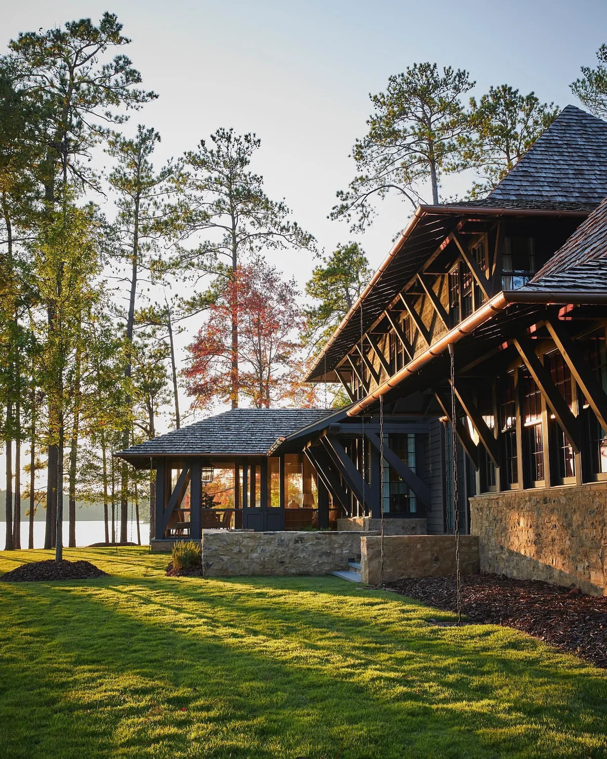 Timber frame lake house with a shingle pavilion