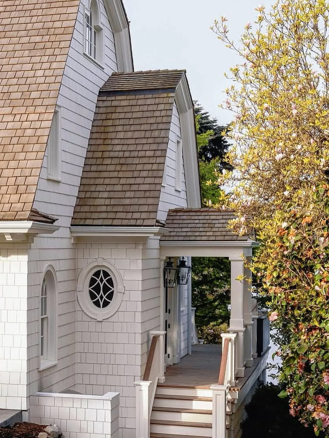 White house exterior with a cedar shake roof