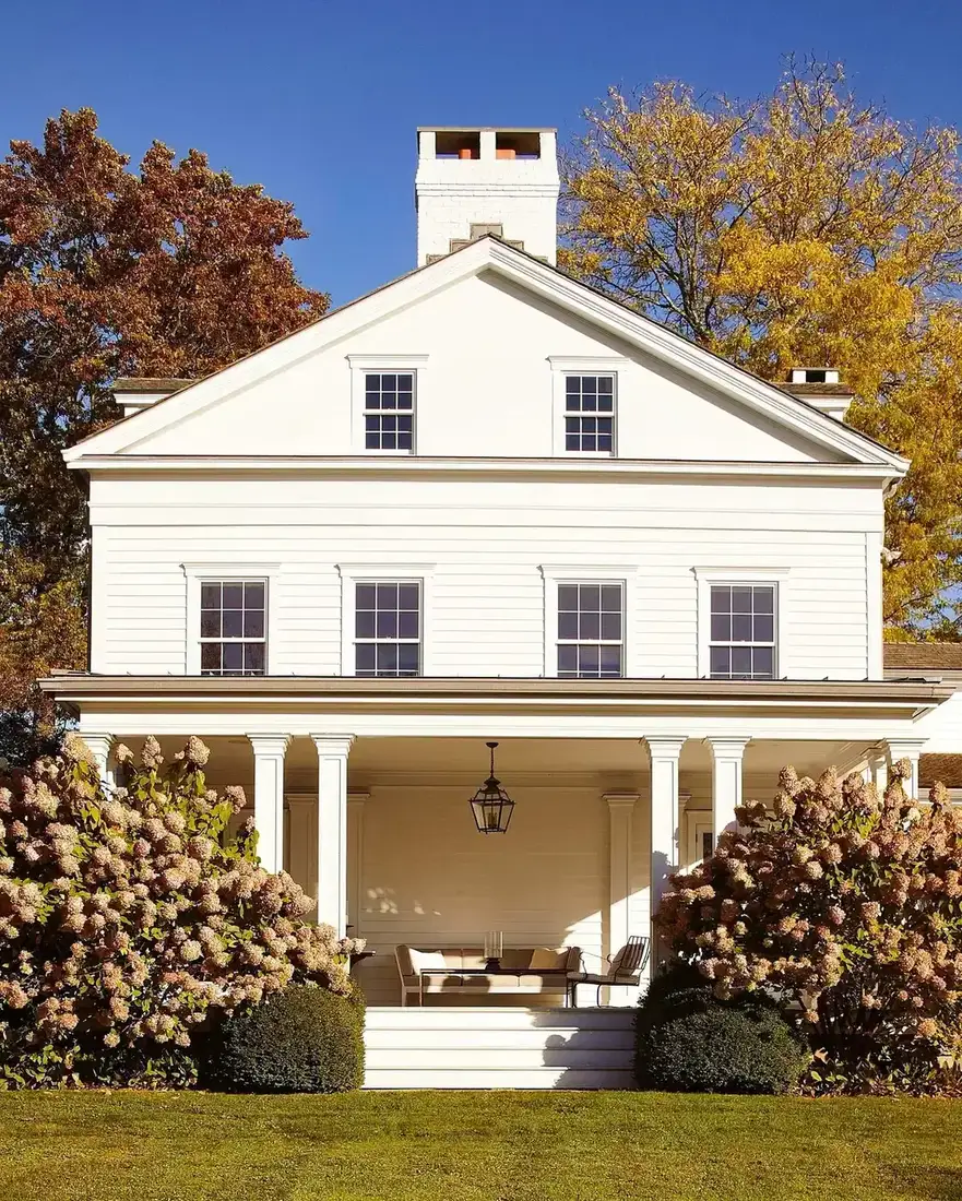 Classic white farmhouse with covered porch
