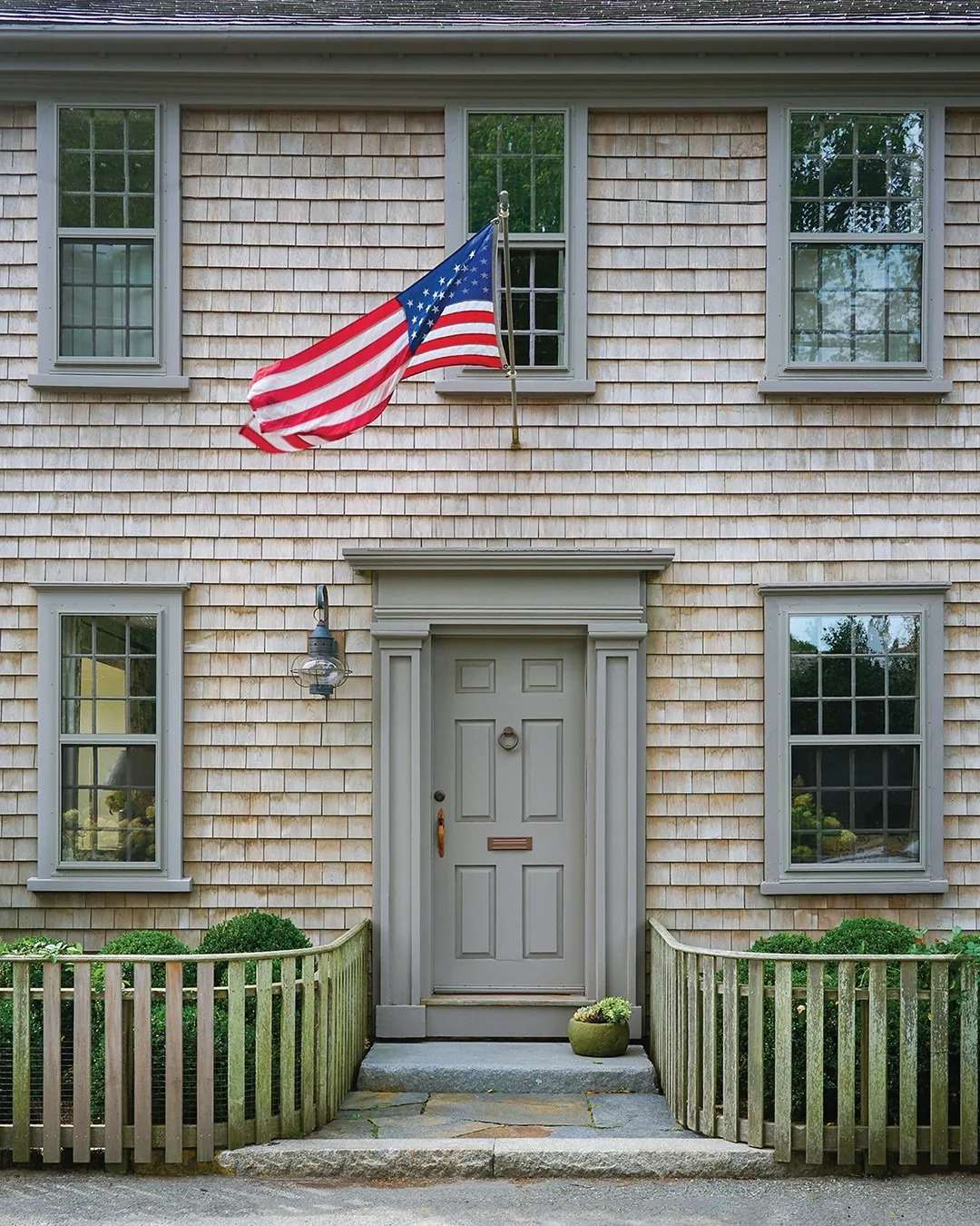 Coastal cottage with a grey front door