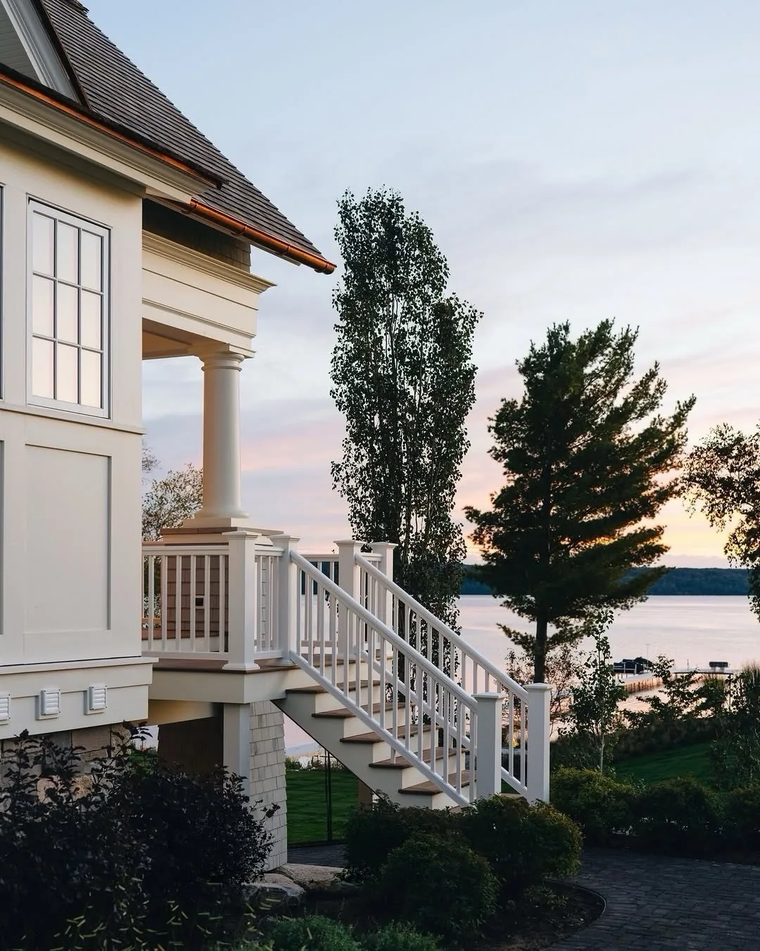 White lake house porch with stair railing