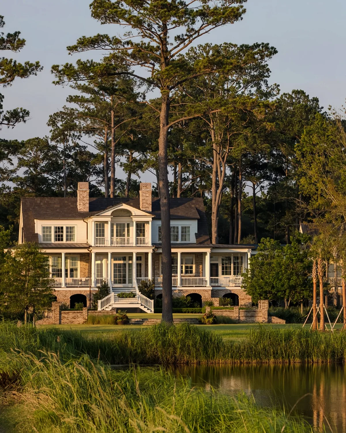 Yellow lowcountry house with a double porch facing the marsh