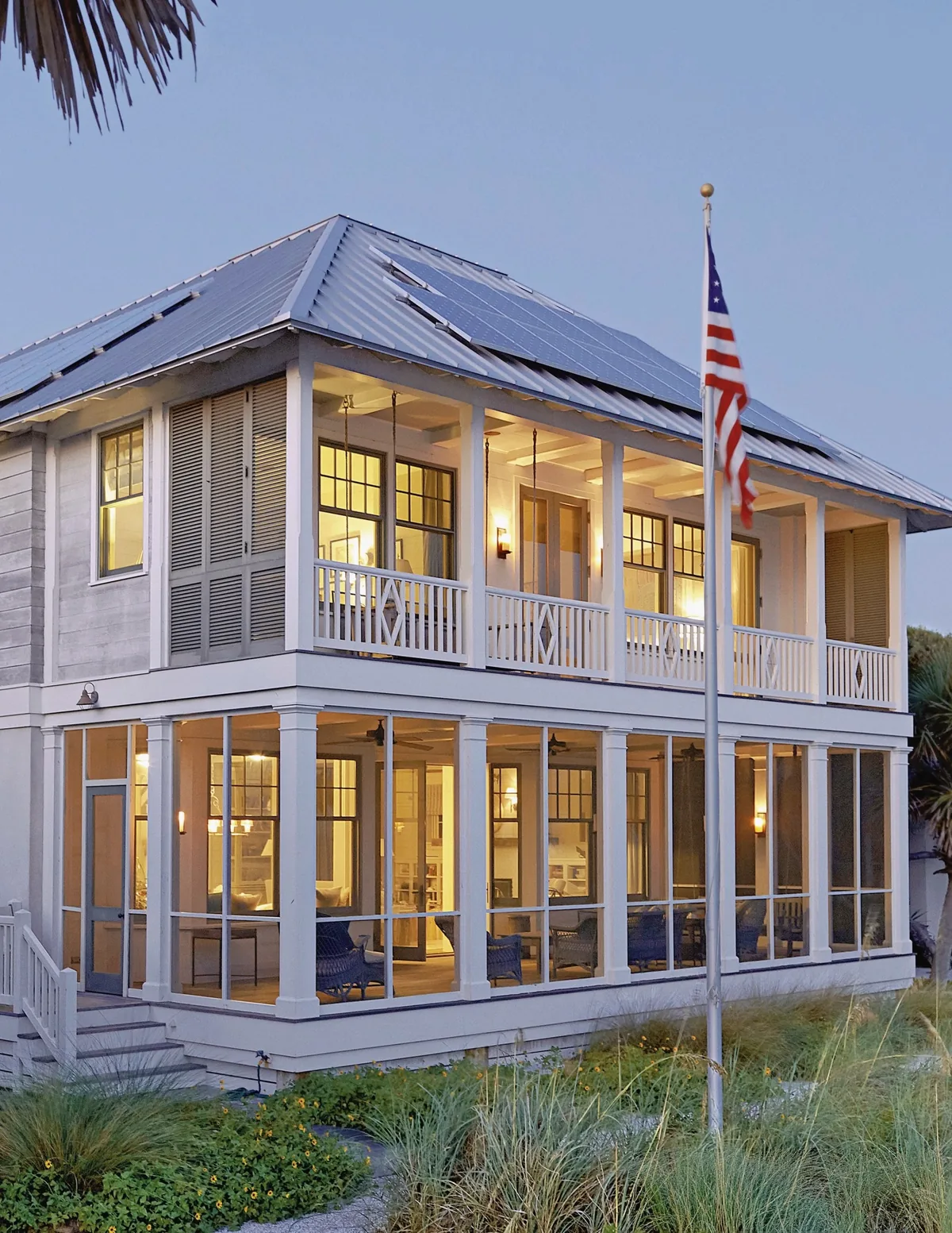 Coastal house with a screened porch under a metal roof