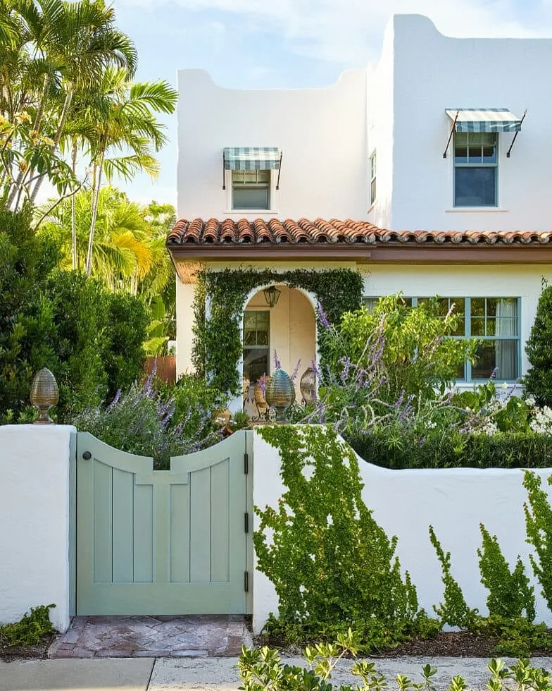 Mediterranean white entrance gate with stucco pillars
