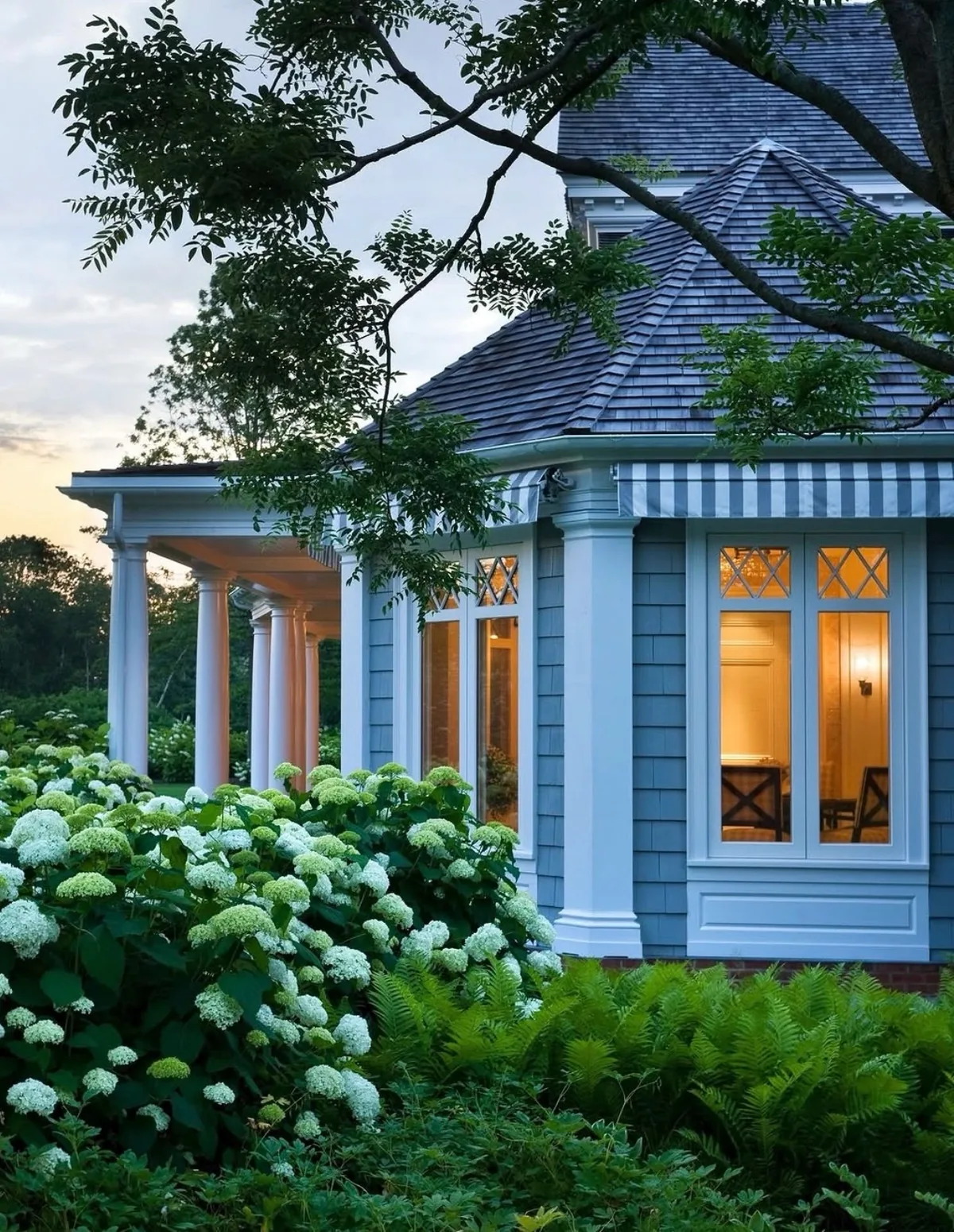 Blue Victorian cottage with a hydrangea garden