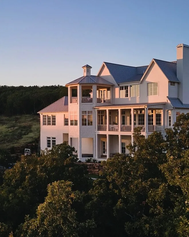 Pink Victorian seaside mansion with porches