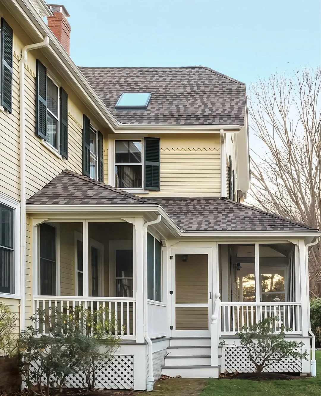 Yellow Victorian house with a wraparound porch