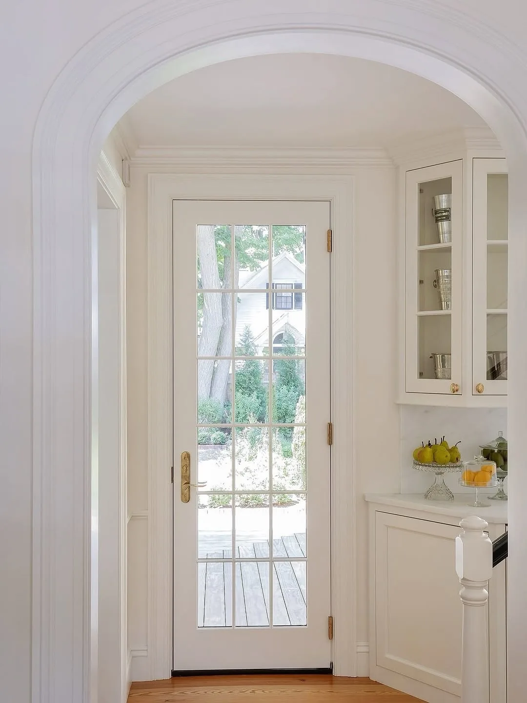 White arched kitchen with French doors