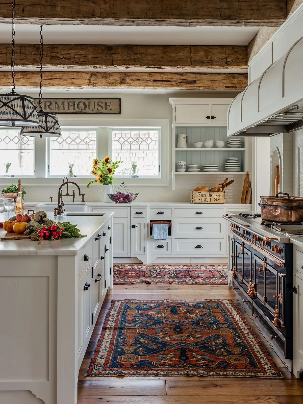 White farmhouse kitchen with beams and a Persian runner