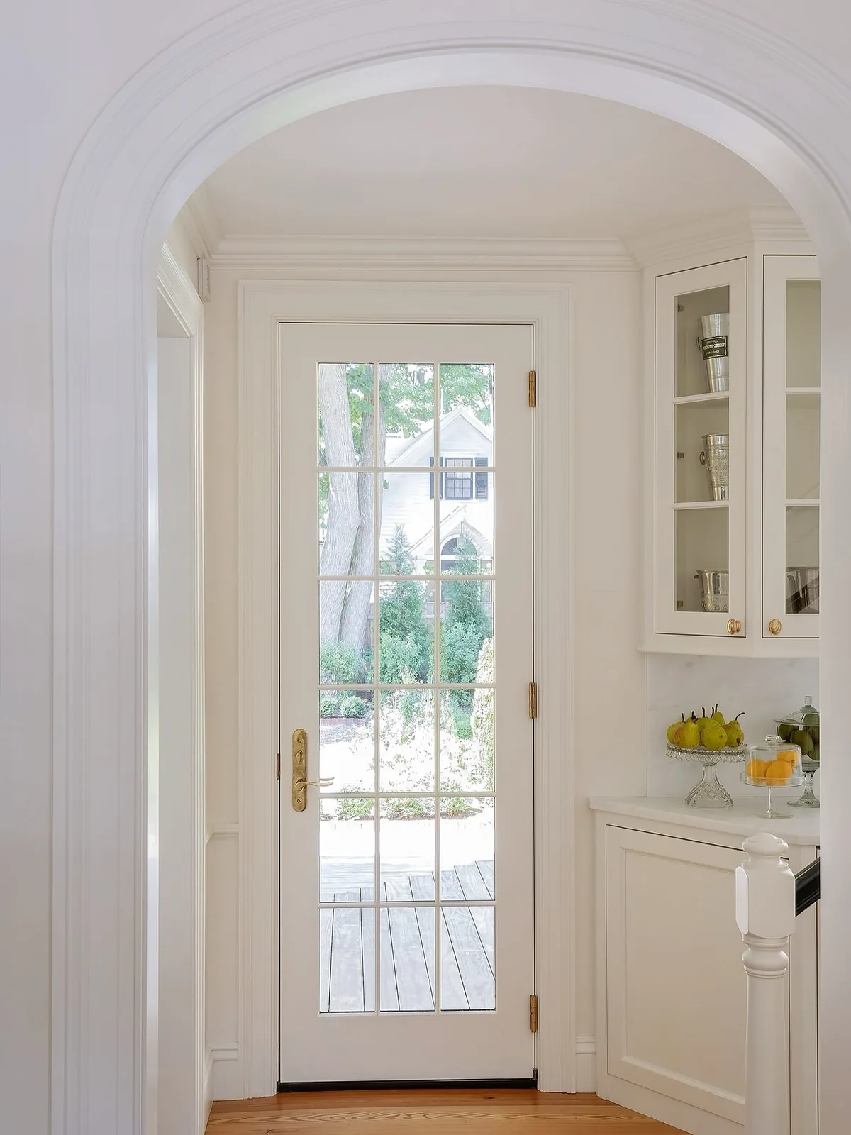White French door with an arched doorway