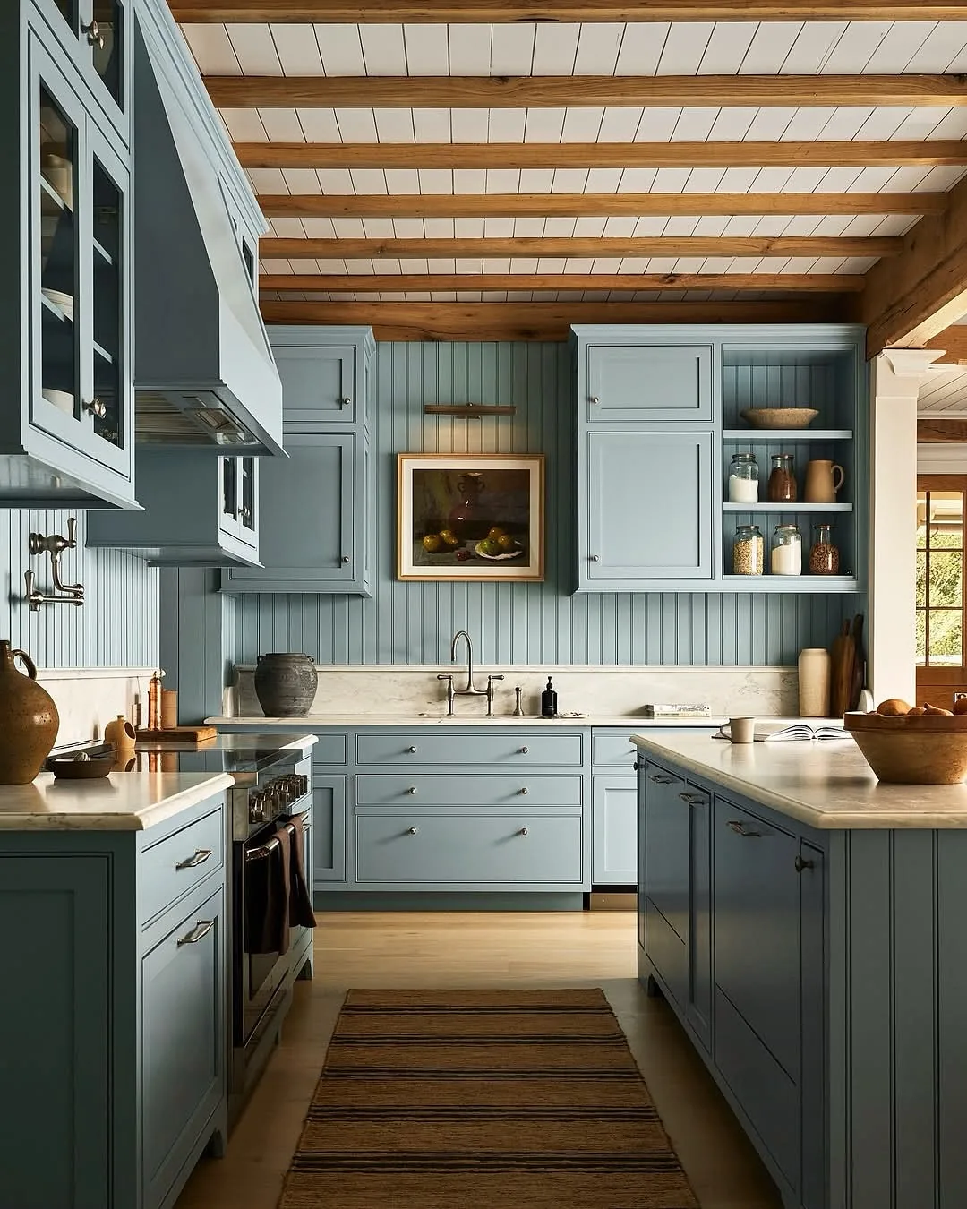 Blue beadboard kitchen with a wood plank ceiling