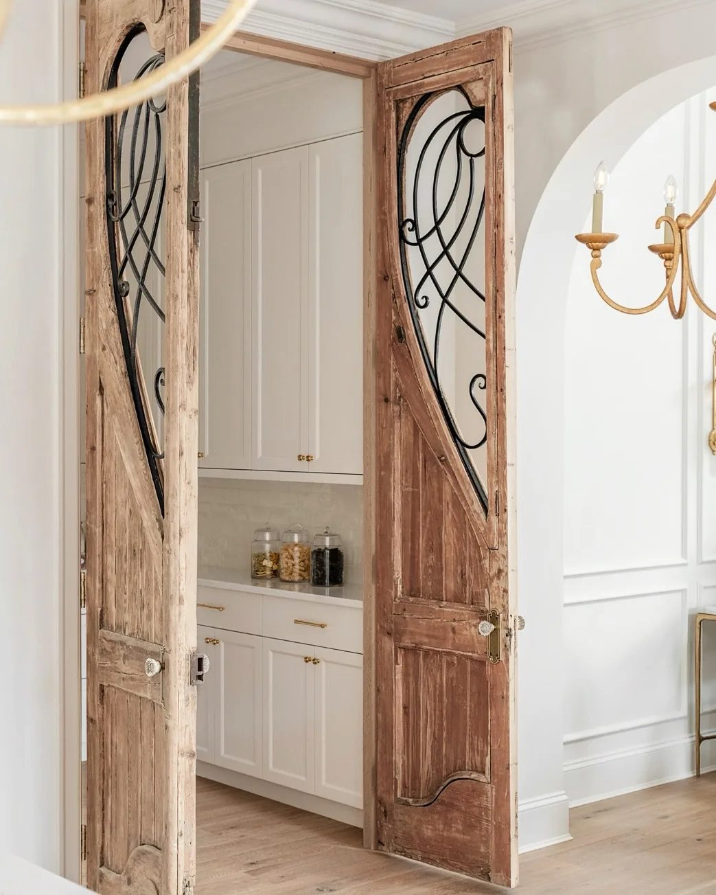 Antique pantry doors with wrought iron details