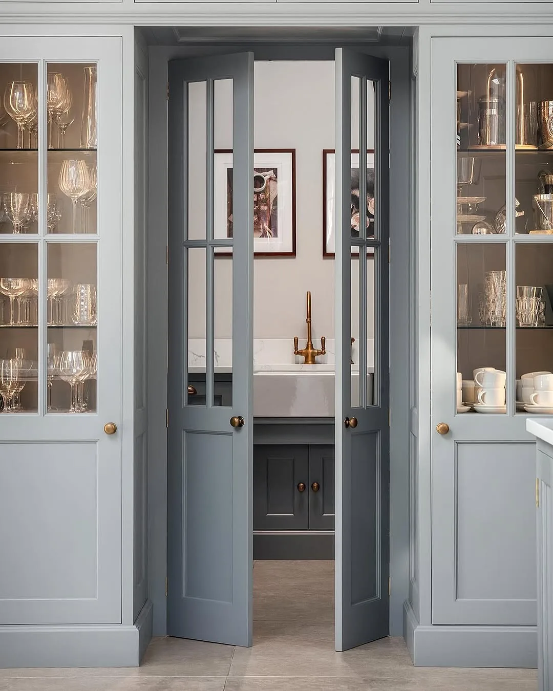 Gray kitchen with glass pantry doors