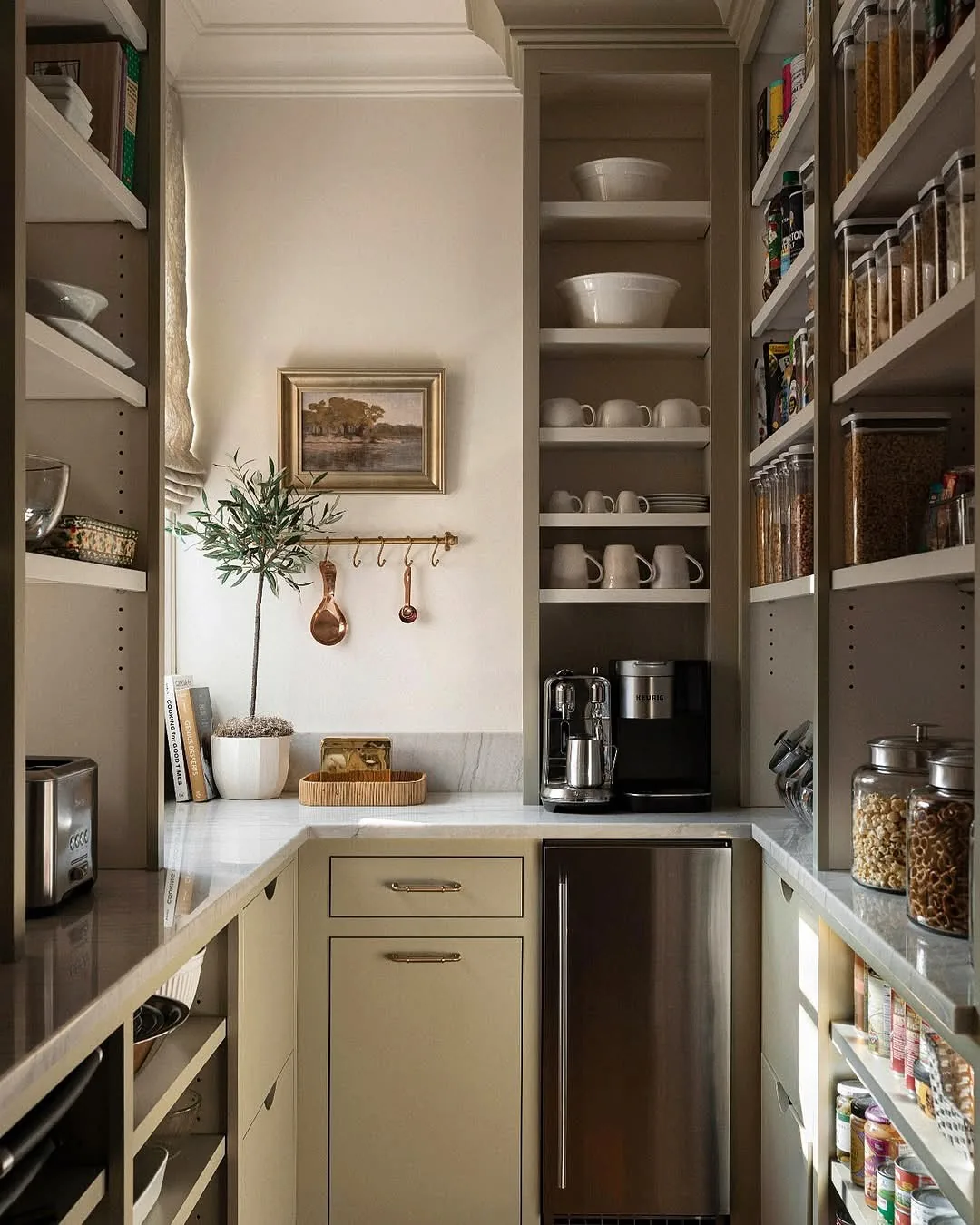 Organized kitchen pantry with a coffee station