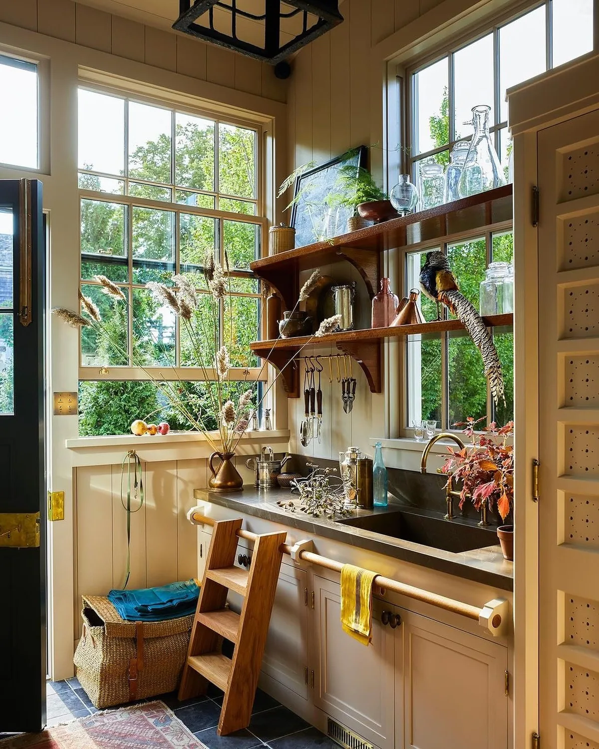 Vintage scullery kitchen with brass taps and windows
