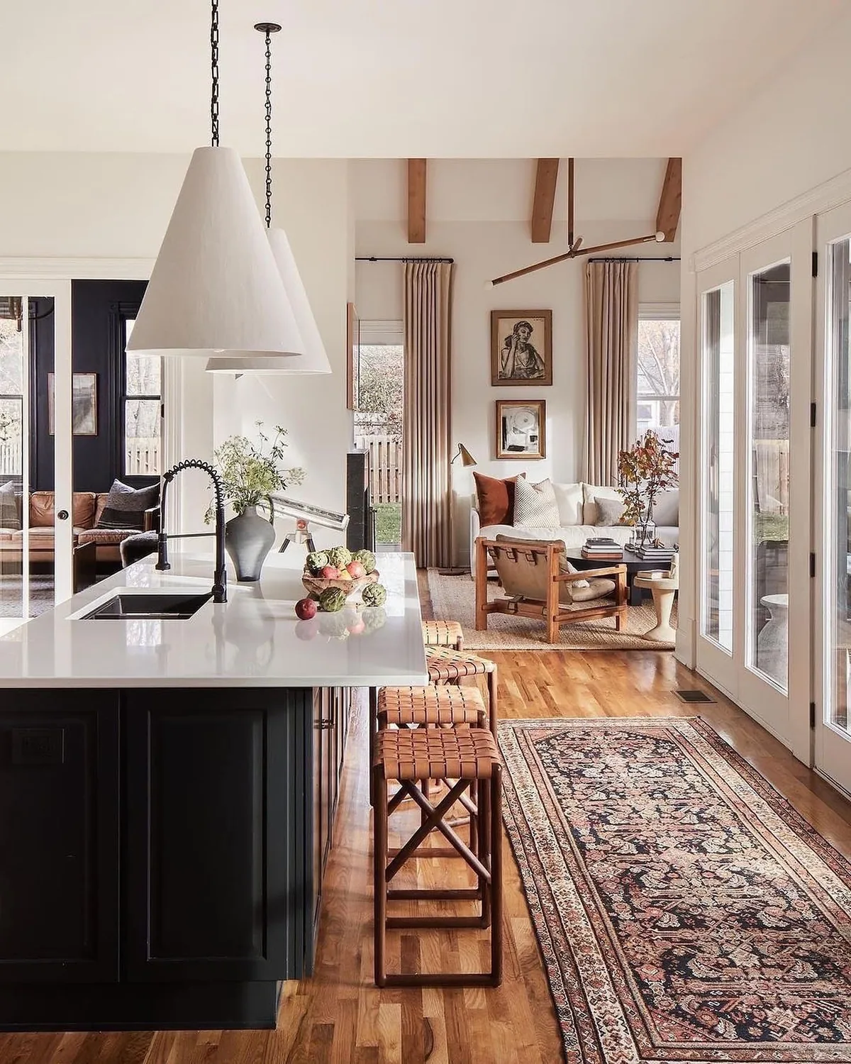 Black kitchen island in an open concept room