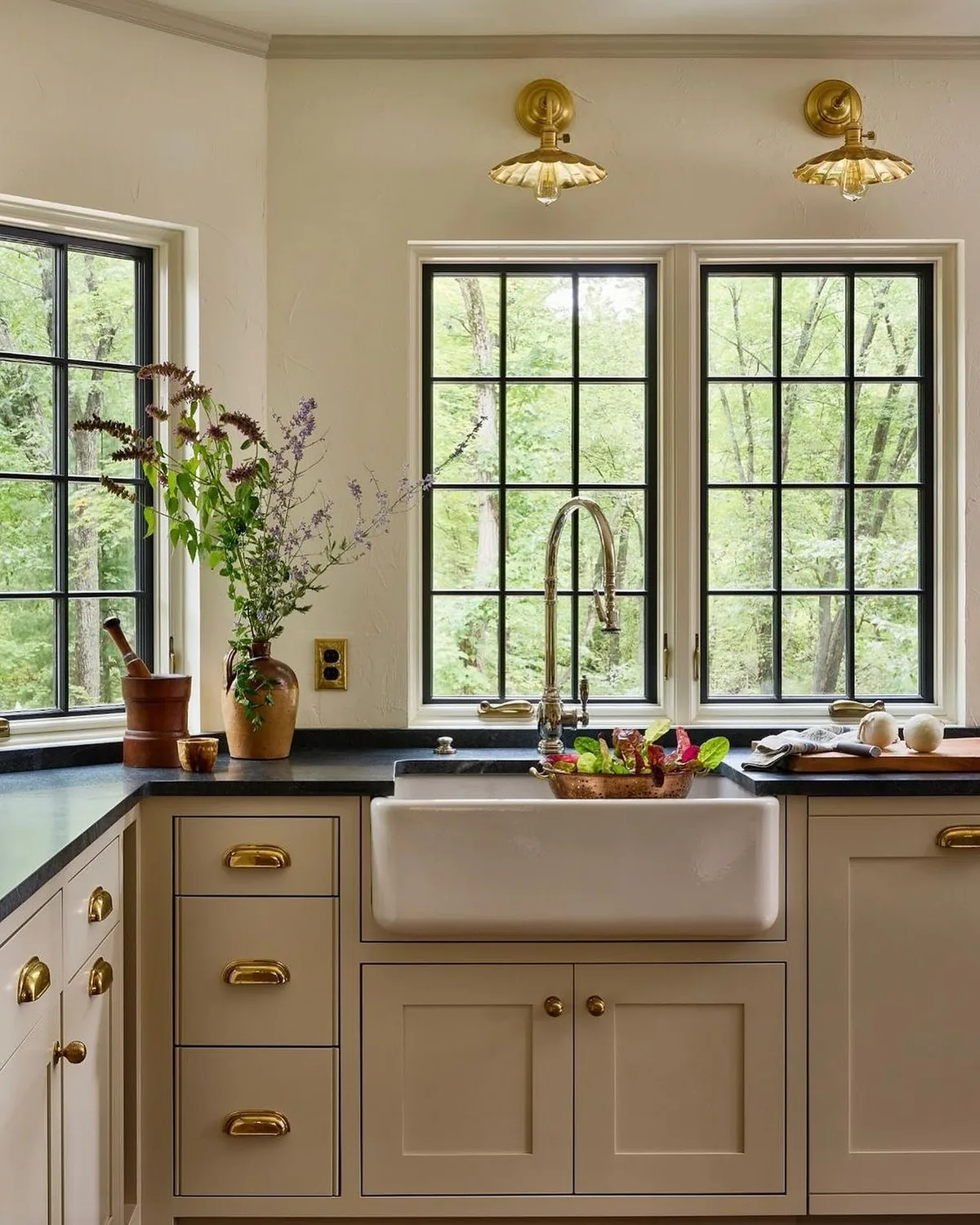 Farmhouse sink kitchen with black windows