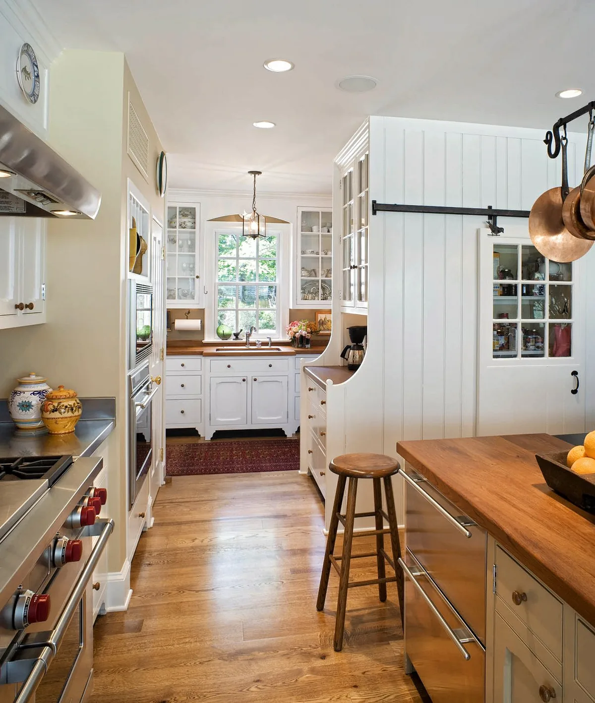 White farmhouse kitchen with a barn door