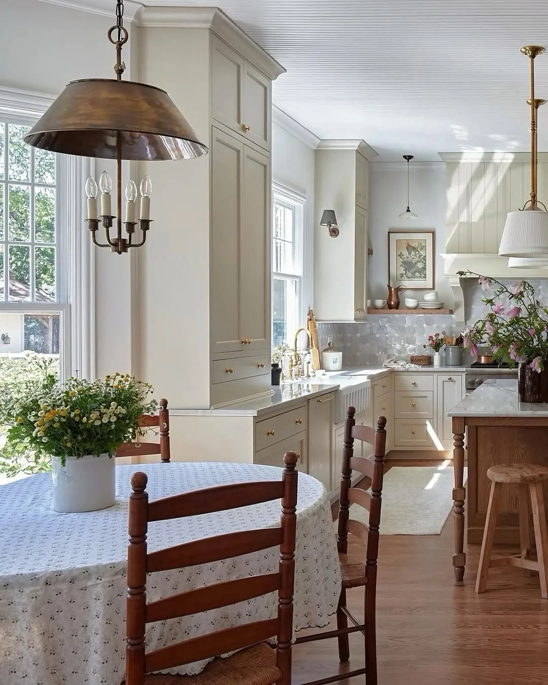 White farmhouse kitchen with a dining room
