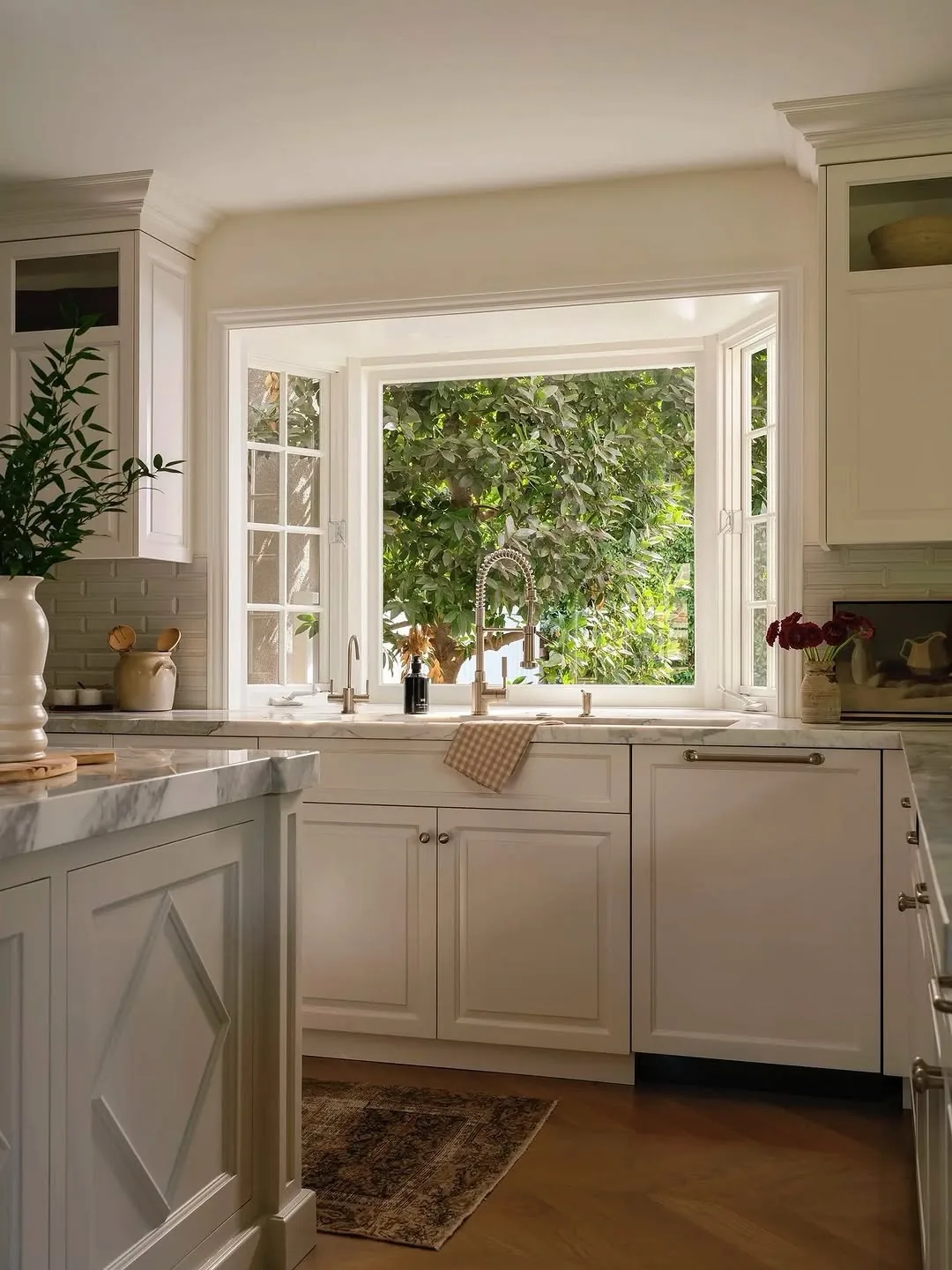 Classic white kitchen with a farmhouse sink under the window
