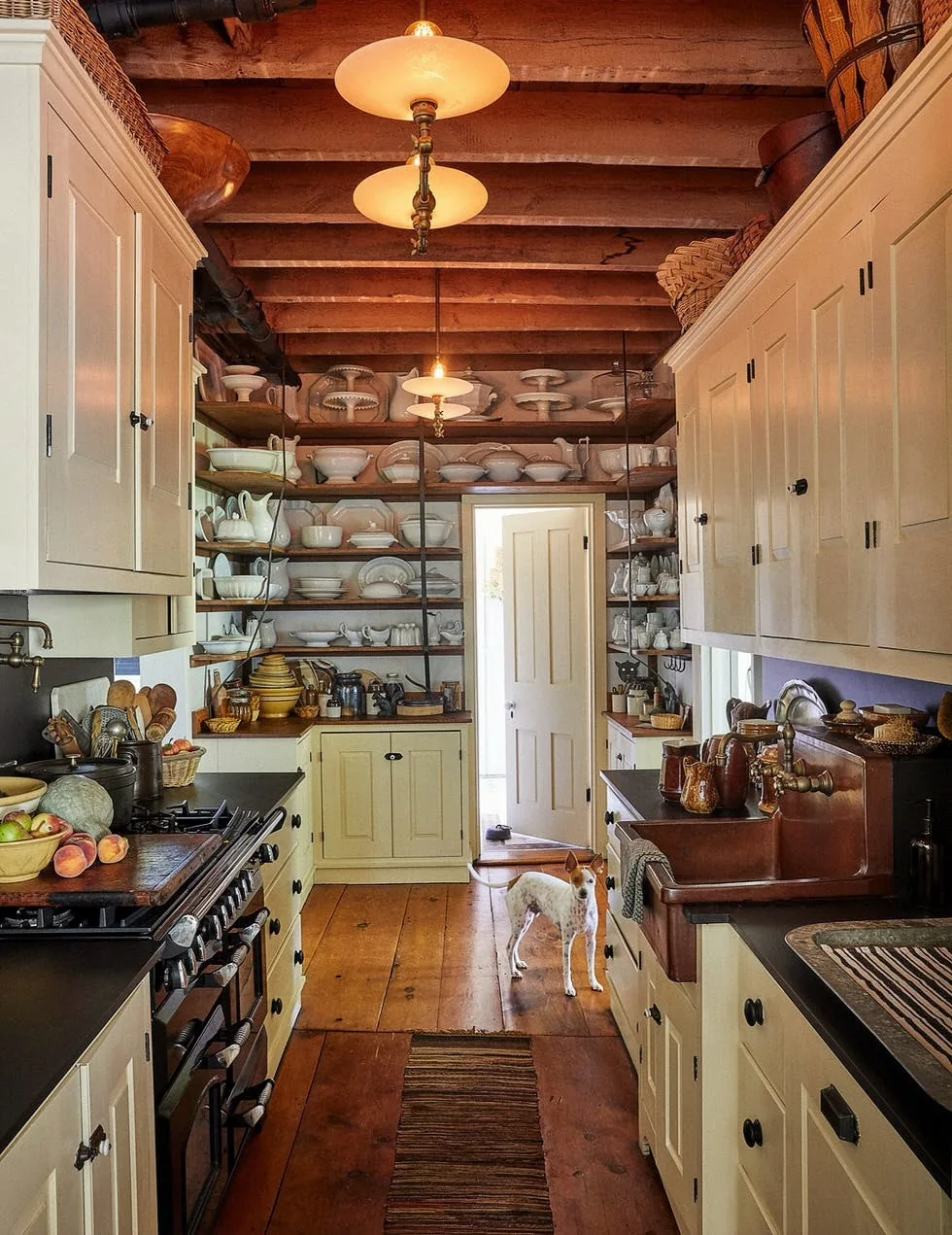 Rustic beam galley kitchen with a copper sink