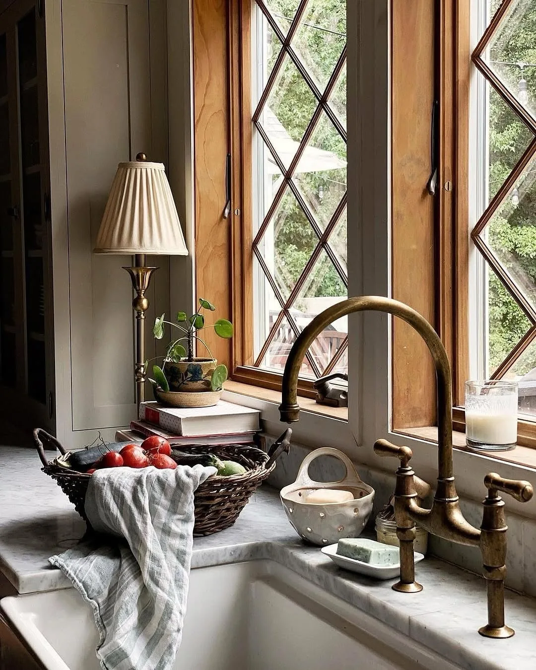 Rustic farmhouse kitchen sink with wood surround