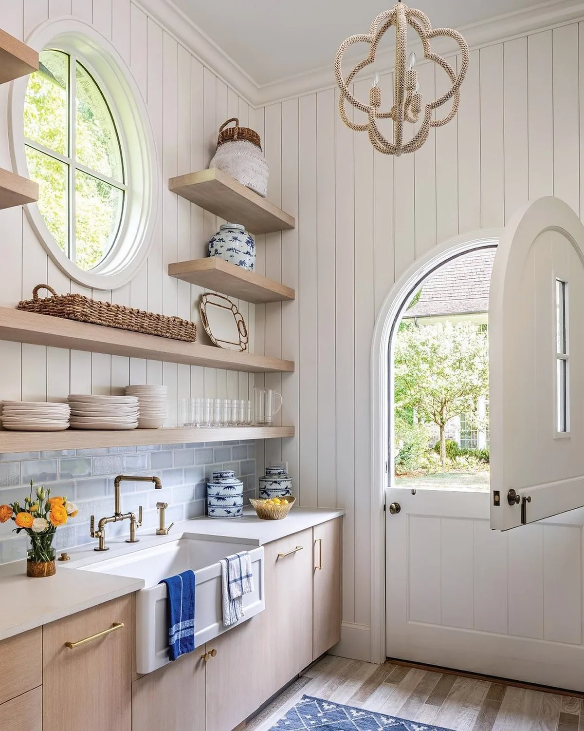 White shiplap kitchen with a farmhouse sink