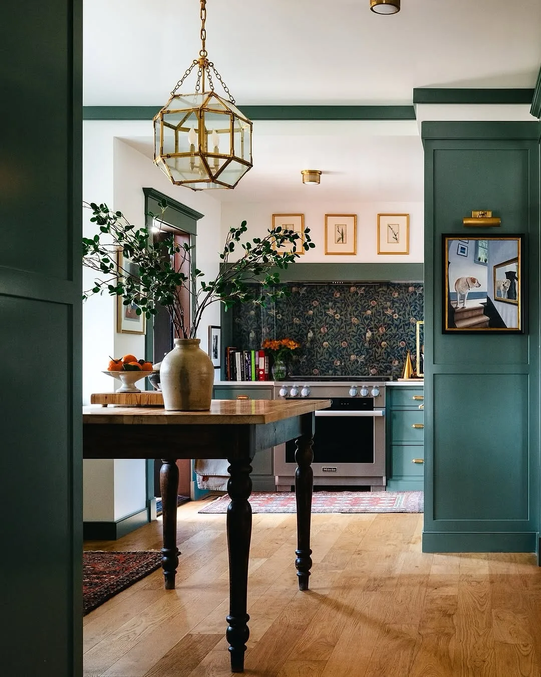 Dark green kitchen with a floral backsplash