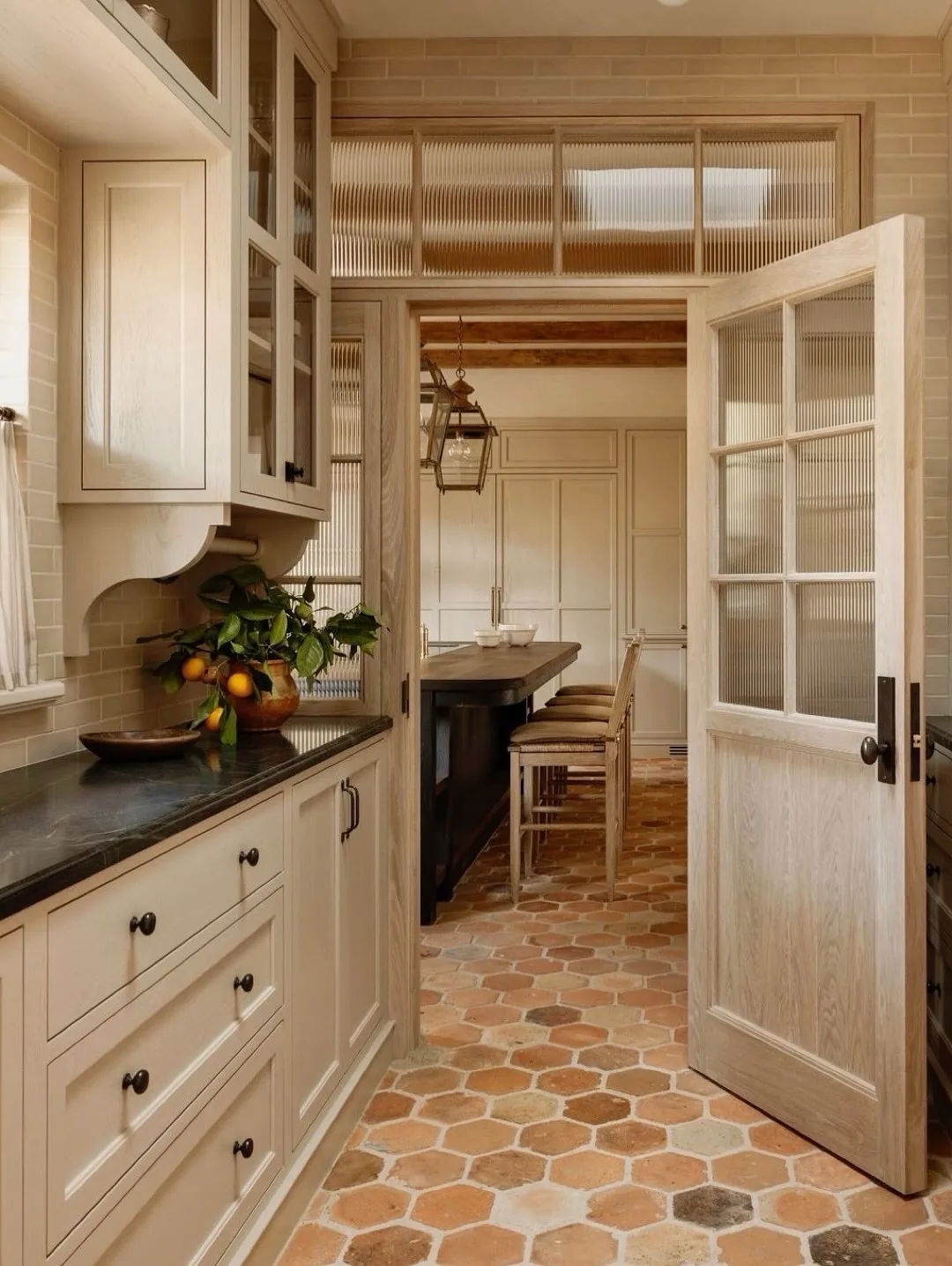 Cream kitchen with a terracotta hexagon floor