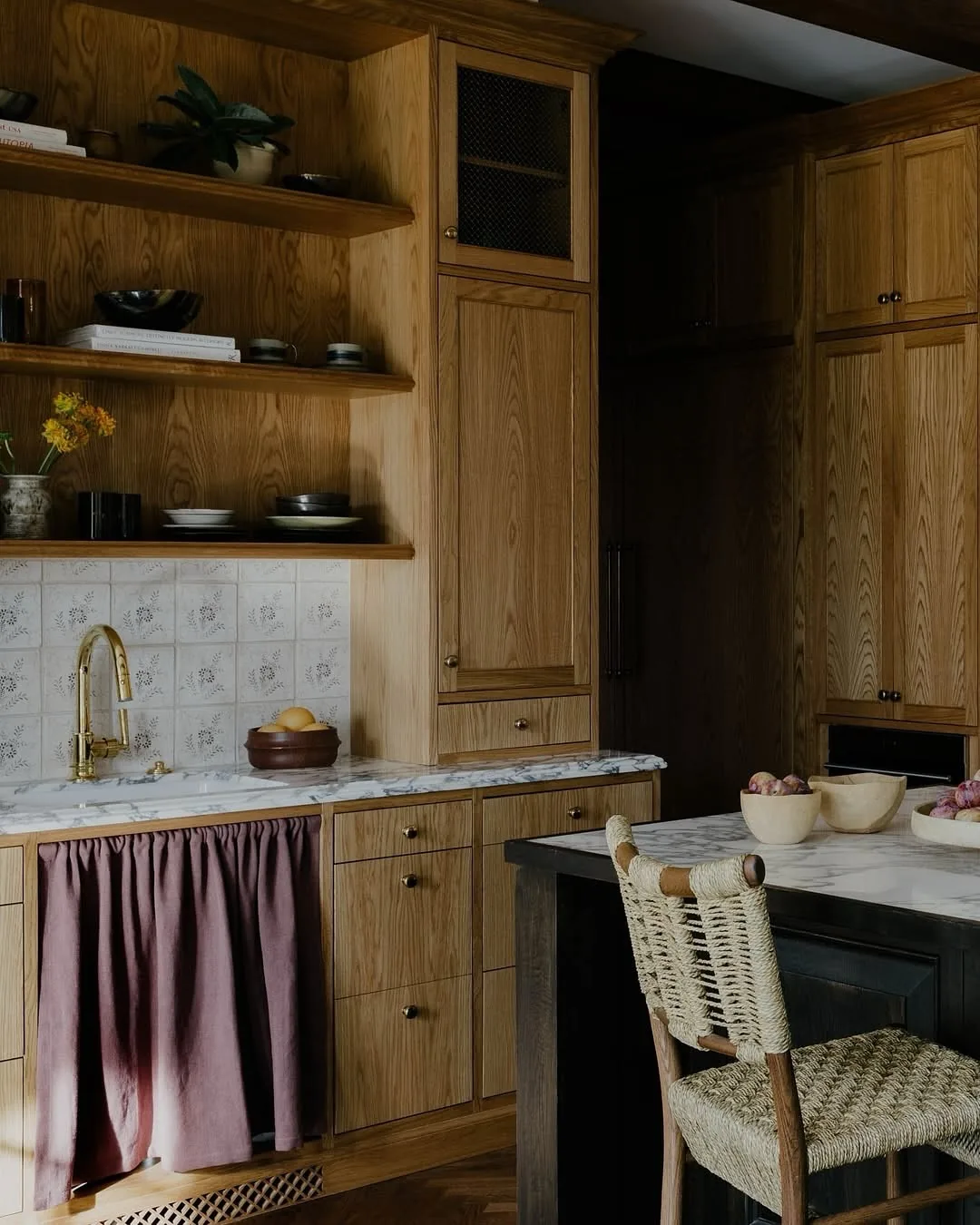 Rustic wooden cabinets in a marble kitchen