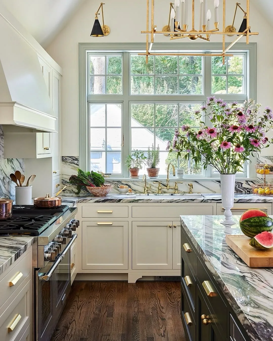 White kitchen cabinets with marble countertops