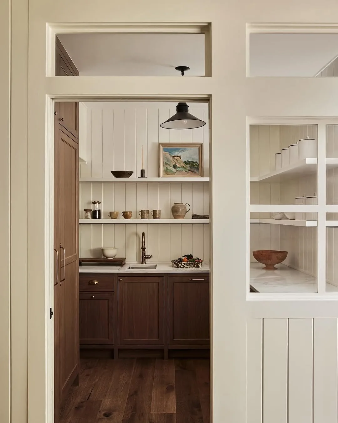 Farmhouse kitchen with open shelving and brown cabinets