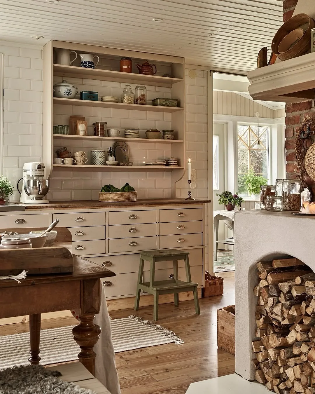 Rustic white farmhouse kitchen shelves with dishes
