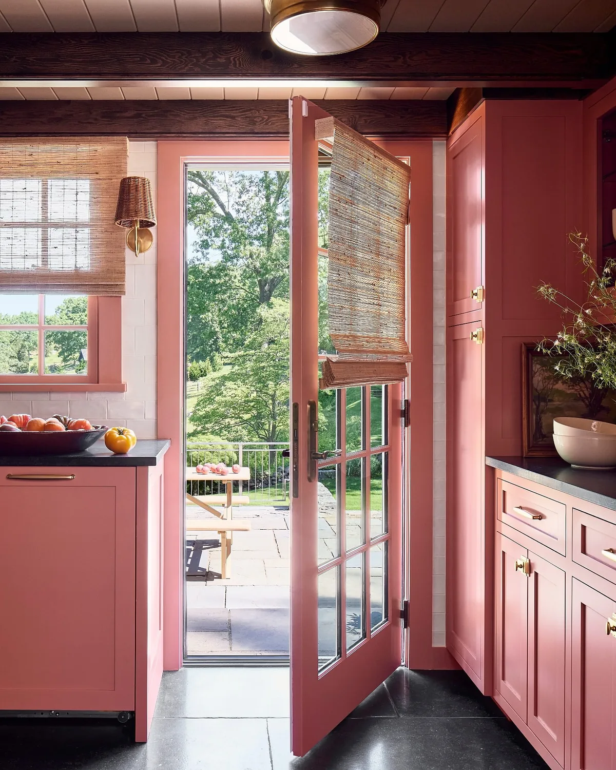 Coral pink kitchen cabinets with French doors