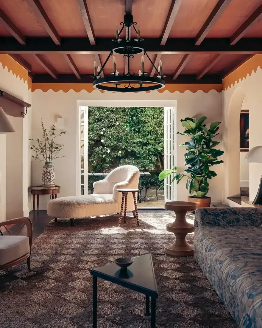 Spanish revival living room with beams, vaulted ceiling and warm textiles