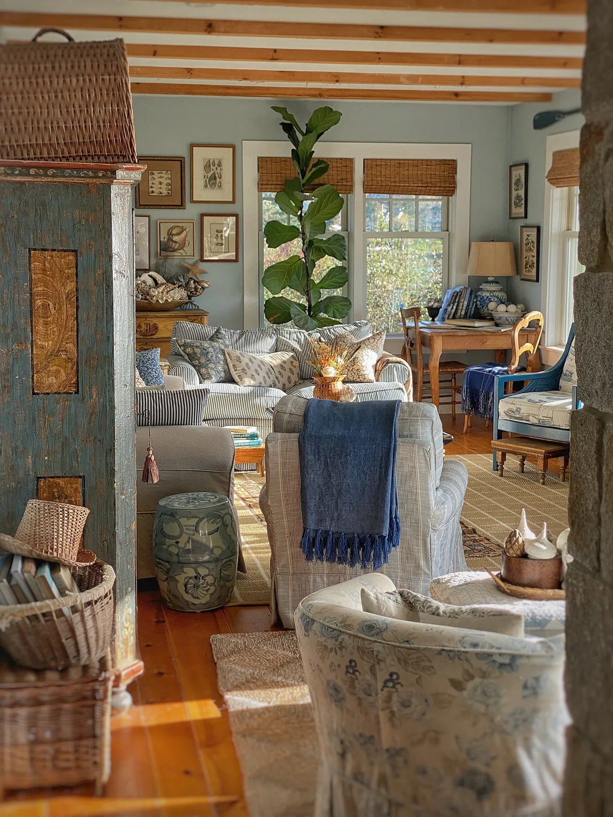 Cozy blue and white living room with layered textiles