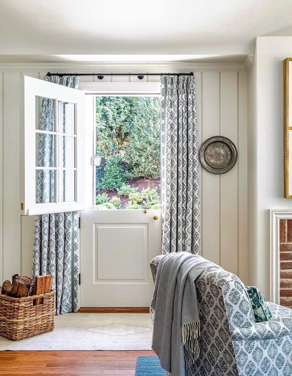 White Dutch door with blue curtains