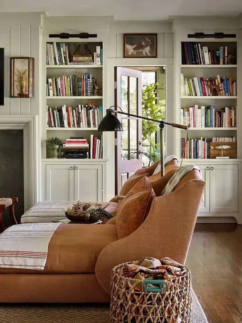 Cozy living room with neutral built-in bookshelves and breathing room
