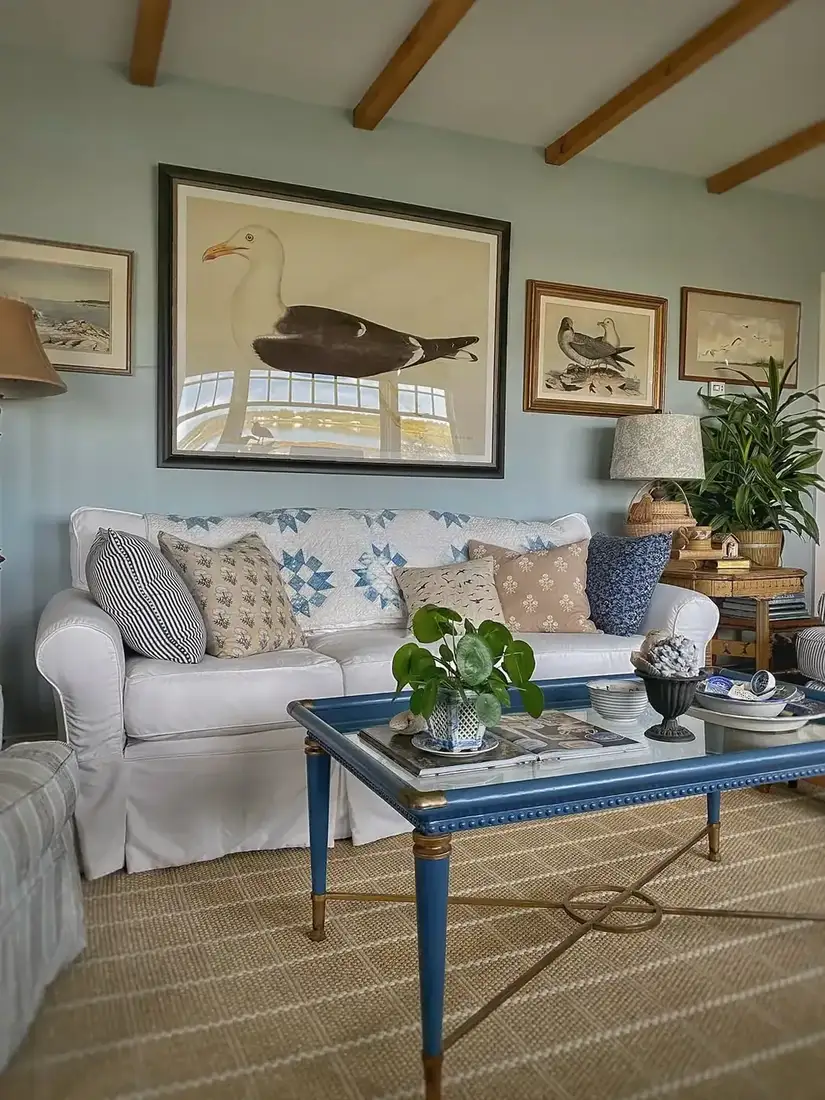 Coastal living room with blue and white decor, striped textiles and calm styling