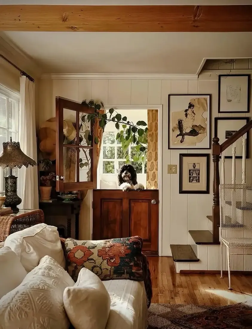 Skirted sofa in an English cottage living room with plain linen and layered textiles