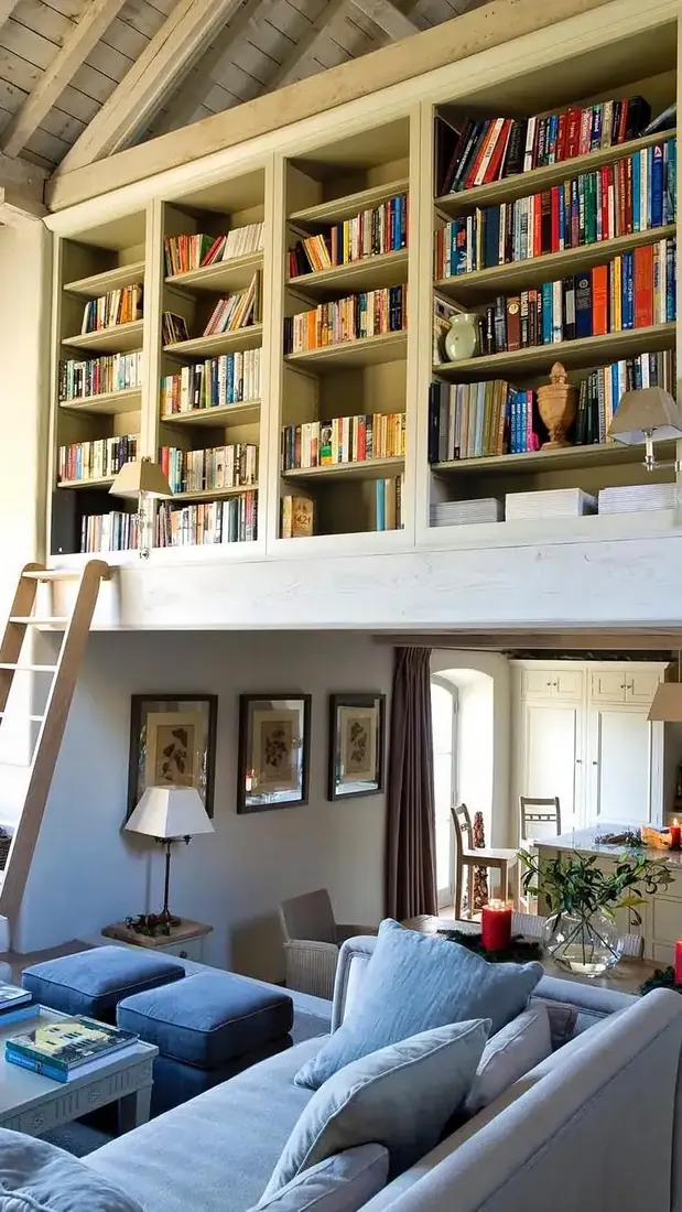 Living room library with rolling ladder against tall built-in bookshelves