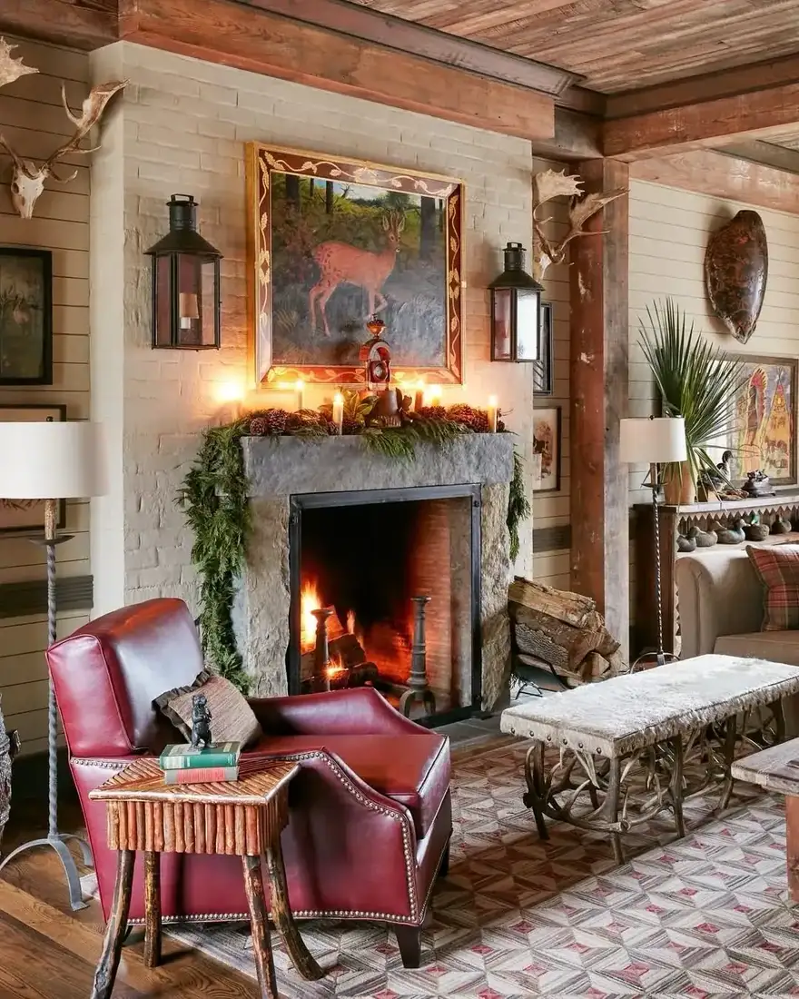 Stone fireplace in a lodge living room with Christmas garland and sparse mantel styling
