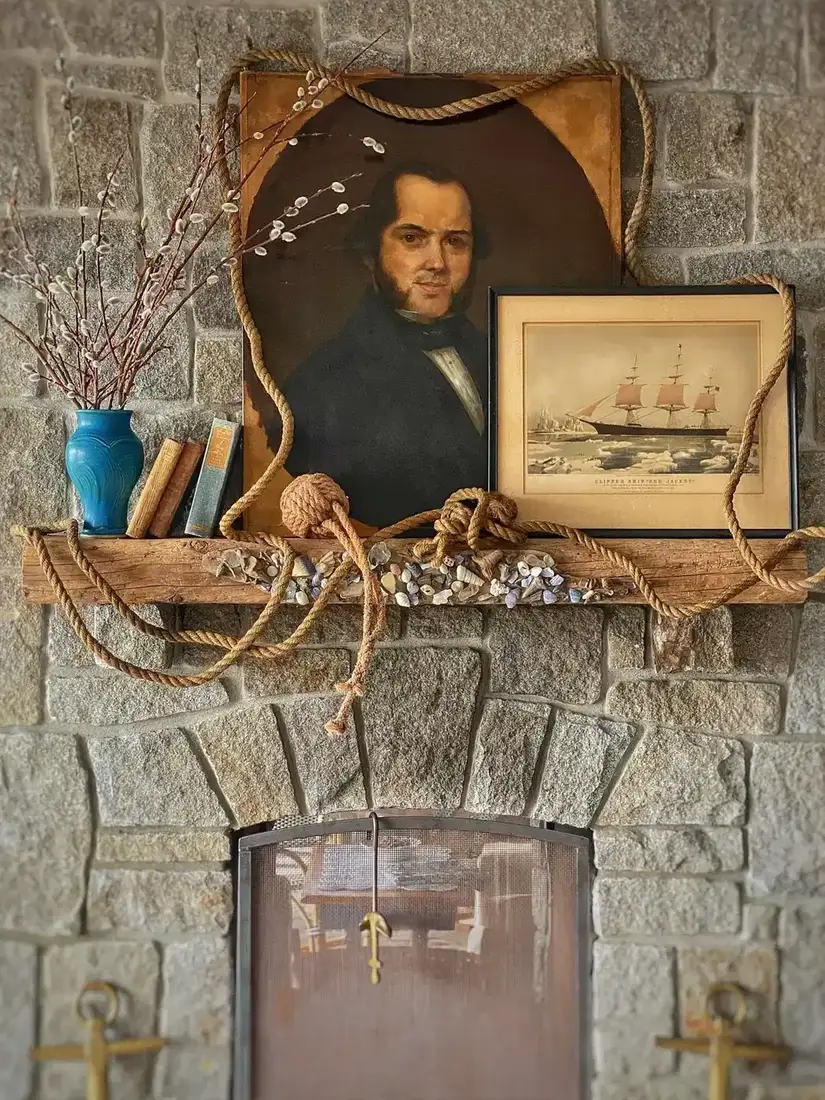 Vintage nautical mantel decor with mirror, brass and sparse styling
