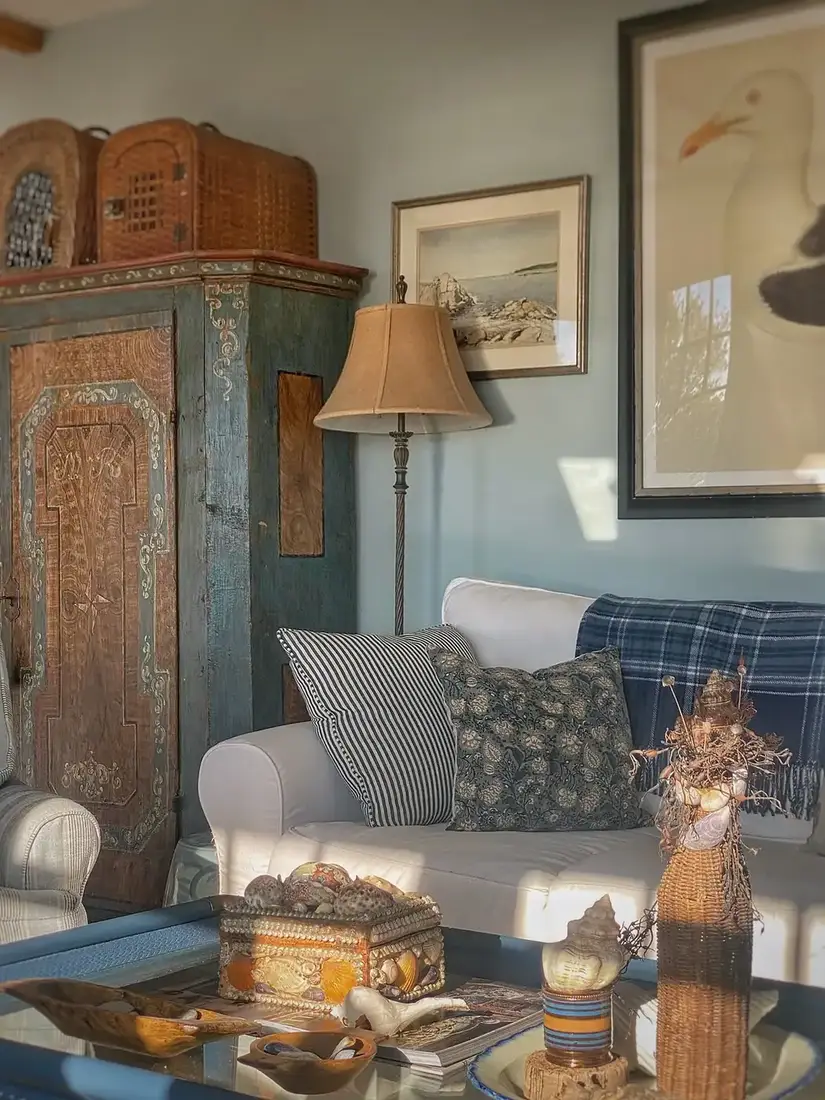 Coastal vintage cabinet with blue and white decor, timber accents and soft light