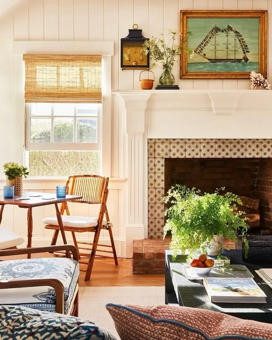 Bright living room with white fireplace and minimal mantel decor and air